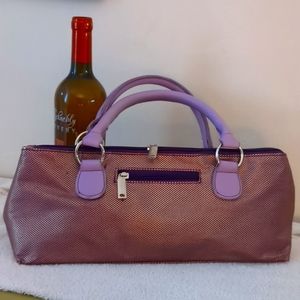 Brand new, never used. Plum colored insulated wine clutch with wine opener.